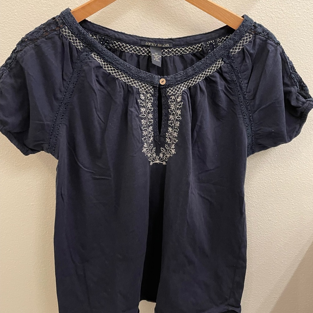 A blue lucky brand t-shirt